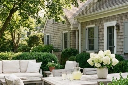 Martha Stewart outdoor aesthetic patio with teak furniture and white hydrangeas