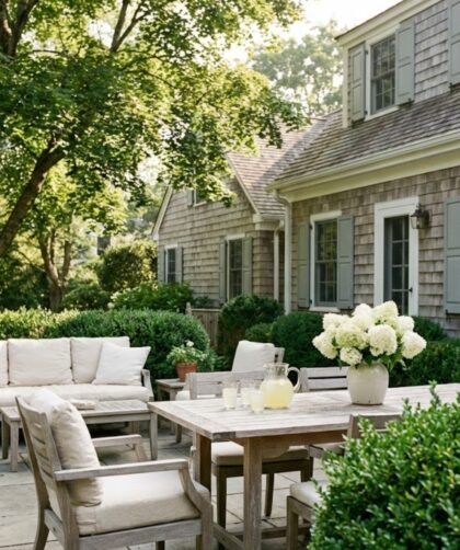Martha Stewart outdoor aesthetic patio with teak furniture and white hydrangeas